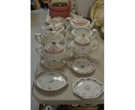 A New Hall type ovoid teapot and cover, pattern 309, decorated with flowerheads and leaves, in iron-red and pink, foliate scr