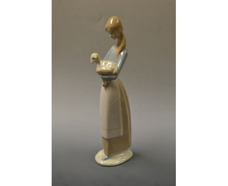 A large Lladro figure, young girl holding a lamb