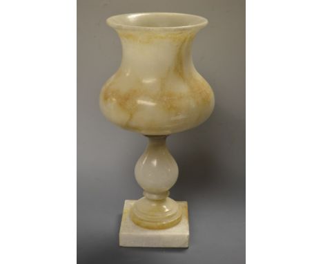 An alabaster turned table lamp and conforming shade