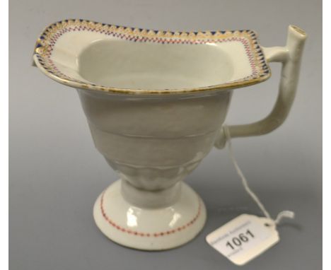A Chinese helmet shaped cream jug, geometrical banded border, rustic angular handle, 11.5cm high, c.1770