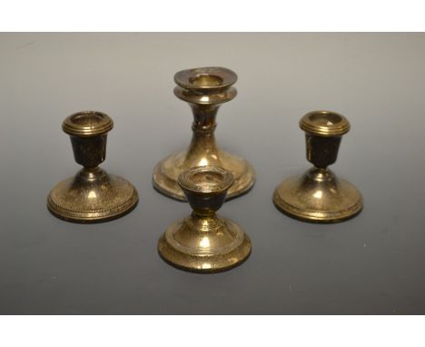 A silver candlestick Birmingham 1925; a pair of miniature silver candlesticks, Birmingham 1985 etc (4)