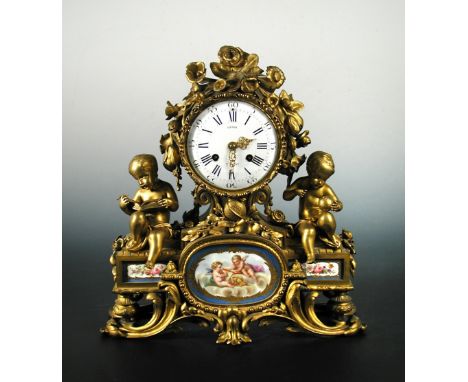 Leroy a Paris, a 19th century French ormolu and porcelain mounted mantel clock, the 13cm dial flanked by two putti emblematic