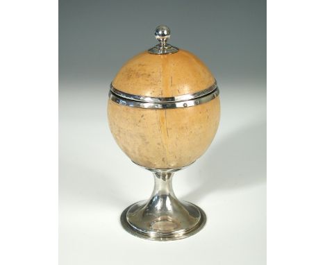 A silver mounted bleached coconut cup and cover, by Henry Rawlings, London 1913,raised on a circular foot with threaded edge,