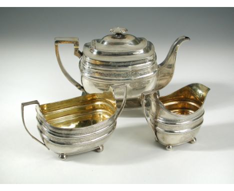 A George III Scottish silver four piece teaset, by James McKay, Edinburgh 1801/1806, comprising:- a teapot (1801) of rectangu