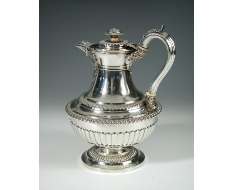 A large George IV silver coffee pot, by Rebecca Emes and Edward Barnard, London 1828, the bowl shaped base part fluted below 