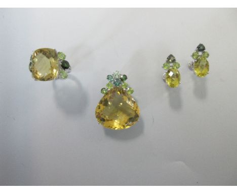 A yellow and green multi gem set suite of jewellery, comprising a pendant, ring and earrings set with quartzes, peridots and 