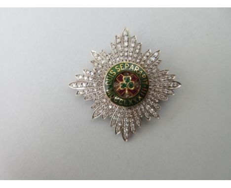 A diamond, emerald, ruby and enamel star brooch of The Order of St Patrick, designed as a cluster of rays in eight points, th