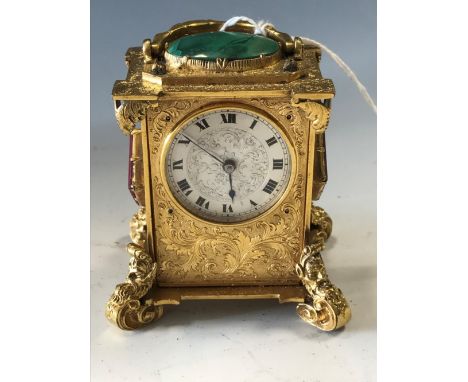 A fine miniature ormolu cased table clock, the silvered rectangular dial engraved and with printed Roman numerals in black, t