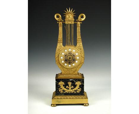 A French 19th century ormolu lyre clock, with applied painted circular numerals, pierced dial centre, bell striking drum move