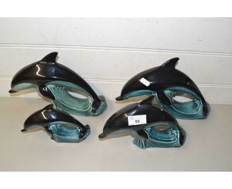 Four various Poole dolphins