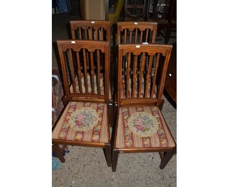 Set of four Edwardian mahogany dining chairs with tapestry seats