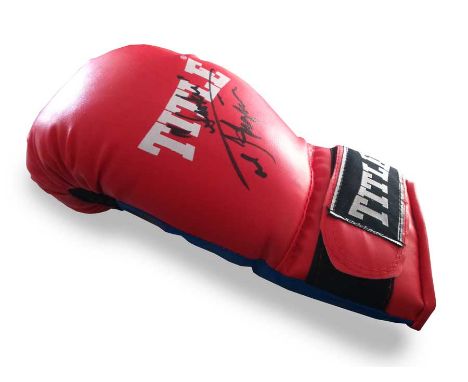 Joe Frazier signed boxing glove. Title Junior boxing glove  autographed by Smokin Joe Frazier (1944-2011). He was an Undisput
