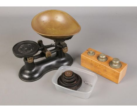 A set of vintage weighing scales and weights.  