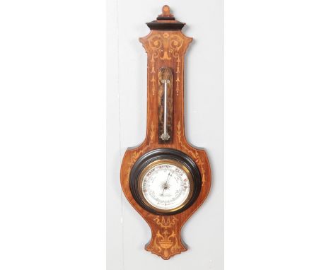 A carved mahogany Aneroid banjo barometer with inlaid decoration.  