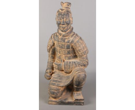 A Chinese terracotta army seated figure. (61cm x 30cm)  