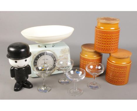A collection of vintage items. Includes Tower scales, Hornsea storage jars, HomePride flour dispenser and Babycham glasses.  