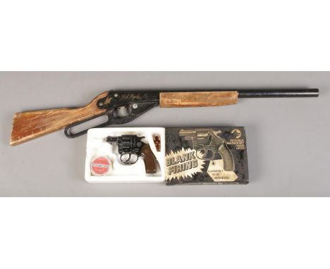 A Sussex Armoury blank firing 'Gambler's Revolver' starter pistol, together with Daisy 'Red Ryder' air rifle.  Can not post.