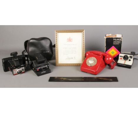 A small quantity of collectables, to include a series of Polaroid cameras, rotary telephone and framed telegraph for recognit