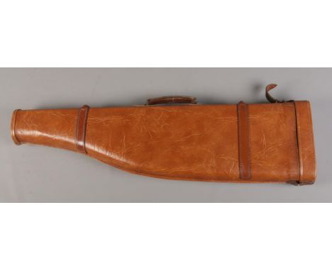 A brown leather shoulder of mutton gun case, with carry handle. 78cm long.  