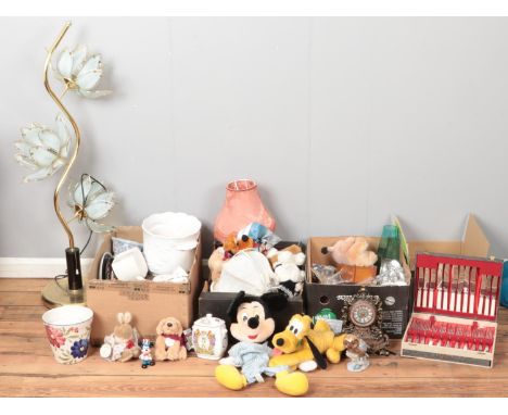 Four boxes of miscellaneous. Including Disney figures and teddies, brass and glass lamp, planters, flatware, mantel clocks, e