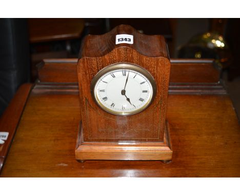 An Edwardian brass inlaid mahogany mantel clock, enamel roman dial.