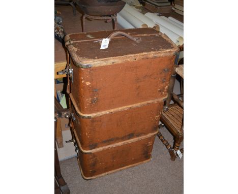 An early 20th Century wooden travelling trunk, lined in canvas with brass fittings, initialled 'RTF' to top, inscribed 'Swinb