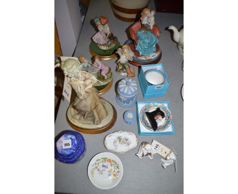 Four Capodimonte figures, to include: mother and child; newspaper boy; Wedgewood blue jasperware; two Royal Crown Derby paper