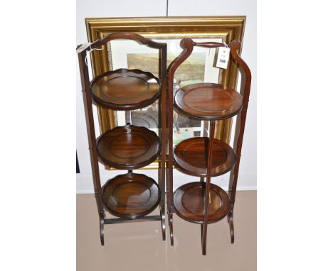 Two 20th Century mahogany folding cake stands; together with a firescreen.  (3)