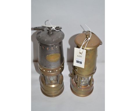 A brass and steel Patterson's miner's lamp, Type GTL9; and a Protector Lamp & Lighting Co. Ltd. miner's lamp, Type 6.  (2)