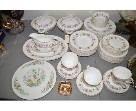 A Royal Doulton dinner service in Rosell pattern, to include: tureens, dinner plates, bowls, teacups and saucers, gravy boat,