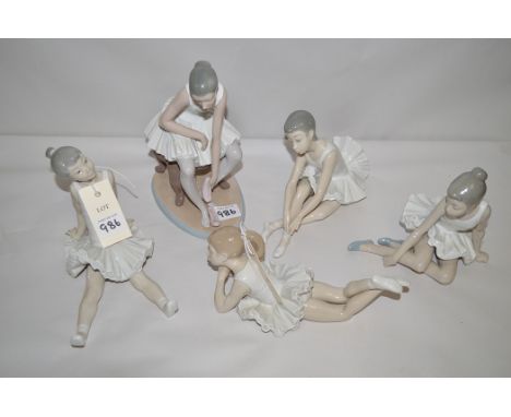 Five Nao figures of ballerinas in various poses.