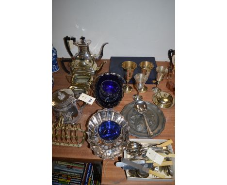 Plated metalware, to include: a three-piece tea service; a Victorian engraved teapot; toast rack; flatware; and other items.