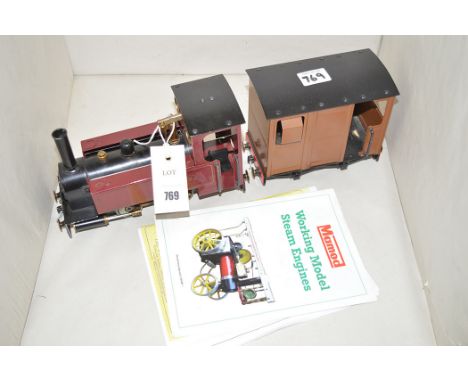 A Mamod LMS model steam engine and guard van; together with leaflets.