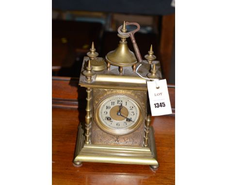 A 19th Century brass eight-day mantel clock, arabic dial, with French movement.