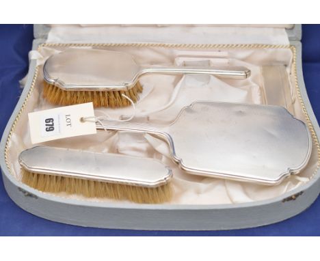 A George VI silver dressing table set, by Walker & Hall, Sheffield 1937; together with associated comb, in fitted case.