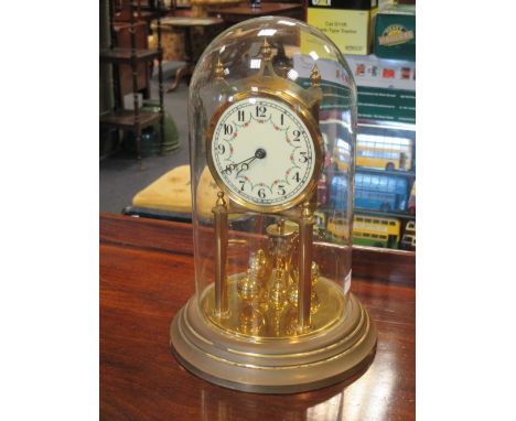 A 400 timepiece under a glass dome, together with an oil lamp  