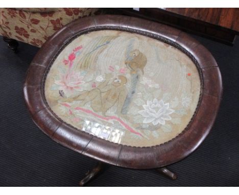 An oak tripod table with a glazed top inset with 19th century gilt thread panel of Monkeys 62 x 63 x 55cm  