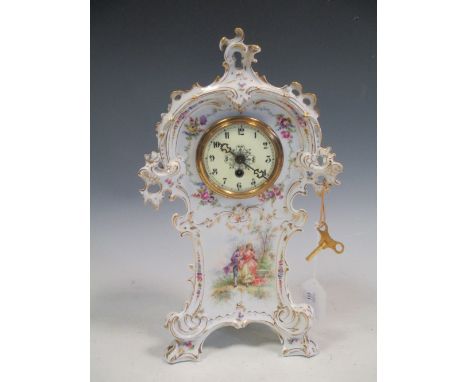 A Dresden floral decorated mantle clock, 34cm high, in working order with key  