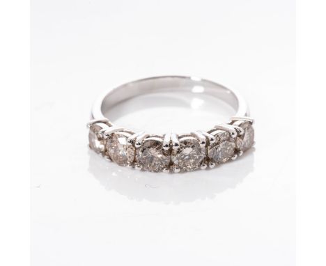 A DIAMOND ETERNITY RING claw set with  6 round brilliant cut diamonds weighing 1,80 carats in total, in 18ct white  gold, col