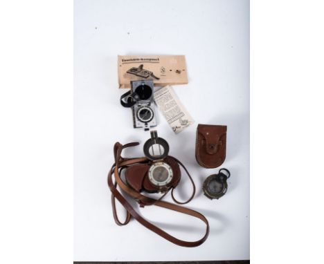 WWII MILITARY ISSUE COMPASS, three in the lot WWII British compass in leather pouch. Made in brass. USA-issue compass in pouc