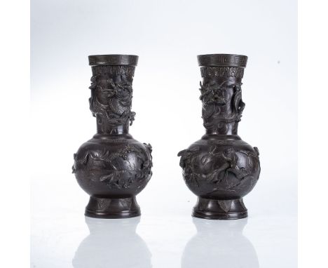 A PAIR OF JAPANESE BRONZE VASES, TAISHO PERIOD 1912-1926 Each raised of a flaring foot, the bulbous body applied with birds a