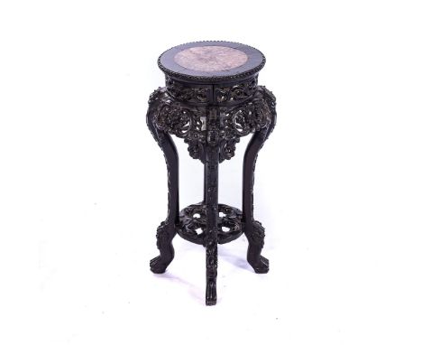 A PAIR OF MISMATCHED CHINESE JARDINERE STANDS The circular marble insets above a key fret border, pierced and carved apron sp