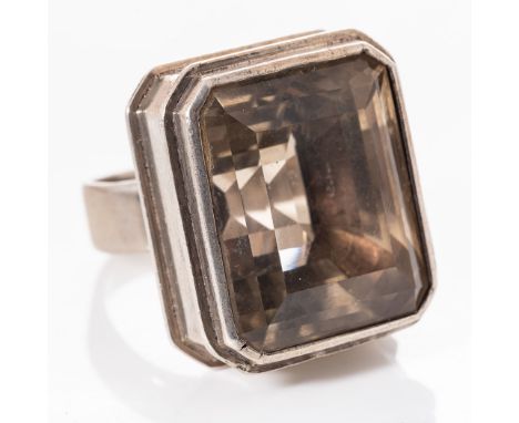 A SILVER CITRENE RING - KURT JOBST Bezel-set to the centre with an emerald-cut citrene weighing 51cts, in a sterling silver f