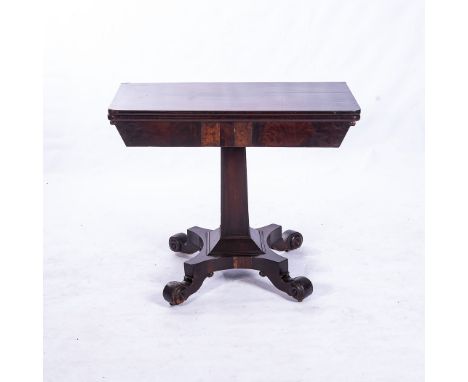 A WILLIAM IV MAHOGANY CARD TABLE The hinged rounded rectangular top enclosing a baize-lined playing surface, on a faceted tap