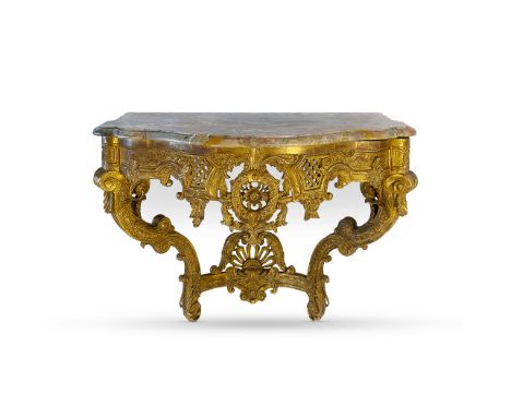 A GILTWOOD AND MARBLE-TOPPED CONSOLE TABLE, 19TH CENTURY The moulded serpentine top above a pierced and foliate-carved frieze