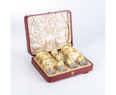 A COPELAND SPODE CASED DEMITASSE SET Comprising: each of the 6 cups and saucers with fine gilt highlights on a pale yellow gr