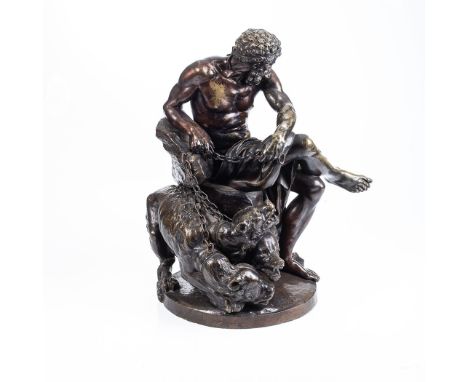 A BRONZE STATUE OF HERCULES AND CERBERUS, CONTINENTAL SCHOOL Depicting Hercules seated with Cerberus in chains at his feet, u