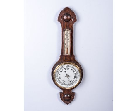 A MAHOGANY ANEROID BANJO BAROMETER Circular white dial with brass bezel below a central thermometer75cm long 