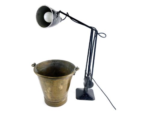 A 20thC metal Anglepoise lamp, with black metal articulated stem, on shaped base, and a brass bucket with swing handle, 32cm 