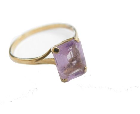 A 9ct gold dress ring, claw set with amethyst coloured stone, size R, 2.2g all in.